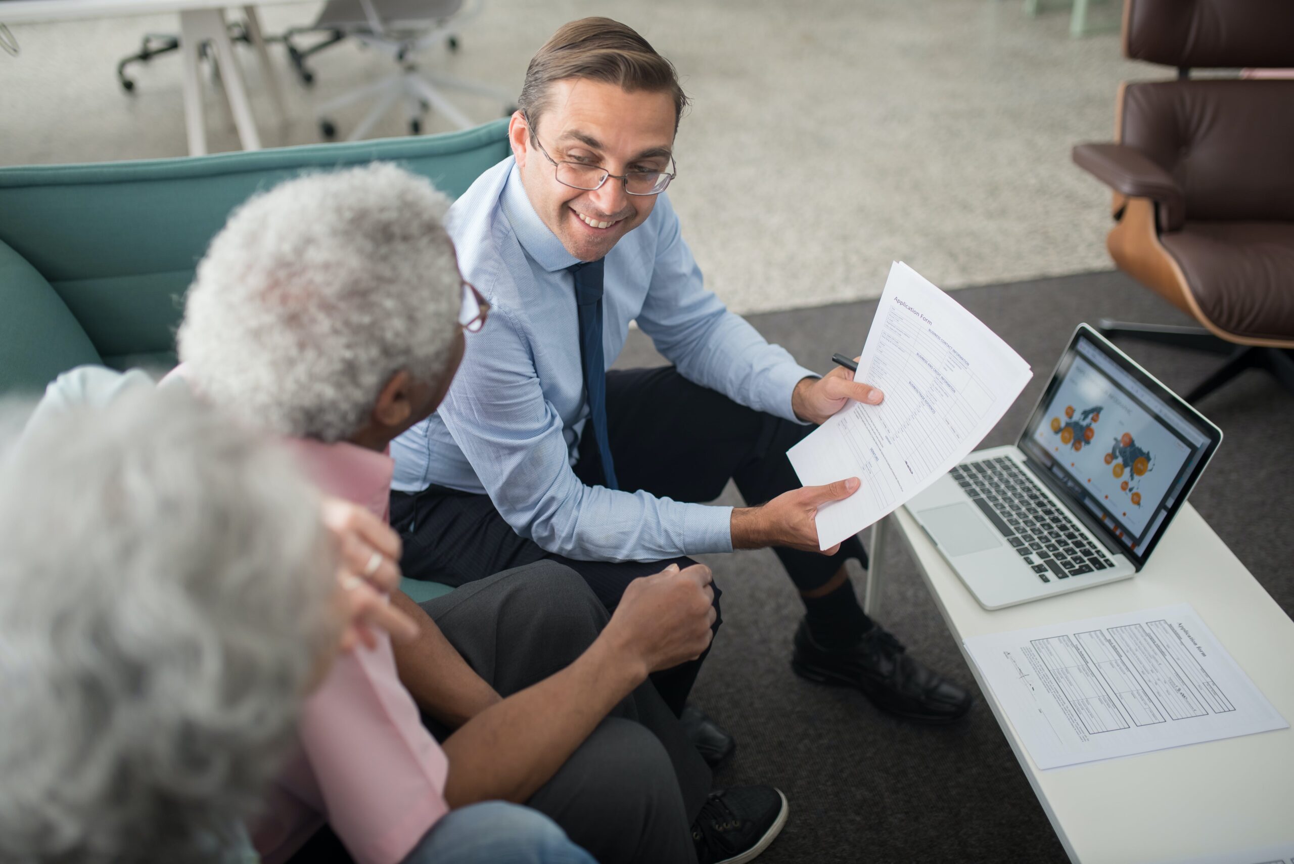 Professional accountant optimizing website for SEO on a laptop surrounded by financial documents