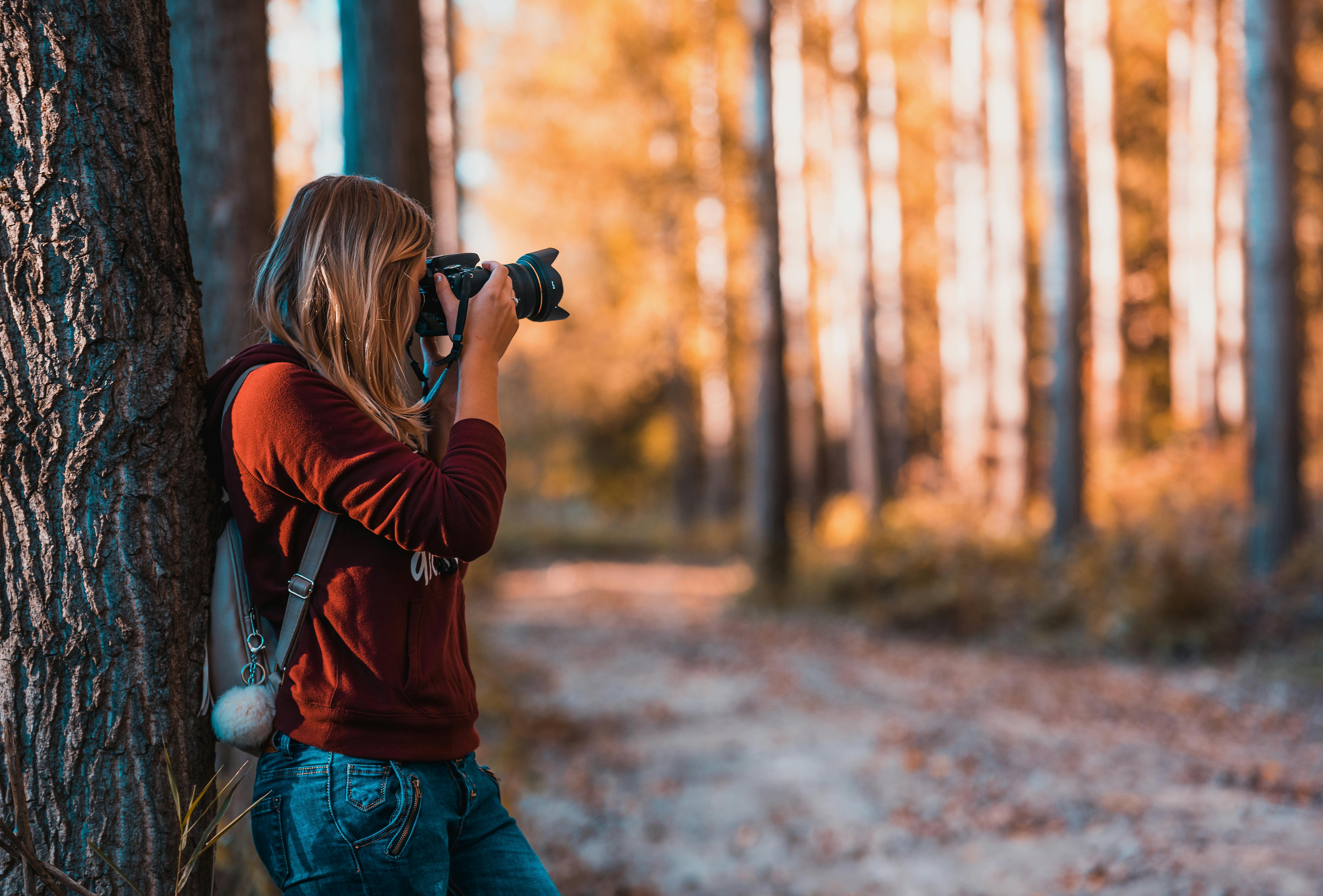 Social Media Presence' - Photographers sharing images on social media platforms, engaging with audience, building brand visibility.